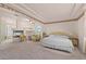 Large main bedroom featuring a fireplace, sitting area, and floral wallpaper at 736 N Kiel St, Henderson, NV 89015
