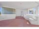 Exterior patio with white wall and glass block provides ample space for leisure at 736 N Kiel St, Henderson, NV 89015