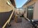 Outdoor patio area with a barbecue grill, dining furniture, and a sun umbrella for outdoor enjoyment at 742 Agave Falls St, Henderson, NV 89011