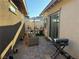 Outdoor patio area with an outdoor seating arrangement, sun umbrella, and barbecue grill at 742 Agave Falls St, Henderson, NV 89011