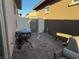 View of outdoor backyard with a grill, seating, and an access gate at 742 Agave Falls St, Henderson, NV 89011