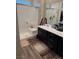 Modern bathroom featuring a glass-enclosed shower, dual vanity sinks, and elegant fixtures at 742 Agave Falls St, Henderson, NV 89011