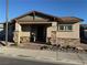 Charming single-story home featuring a well-manicured front yard and inviting facade with stone accents at 742 Agave Falls St, Henderson, NV 89011