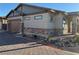 Attractive home exterior with a two-car garage and a brick-paved driveway at 742 Agave Falls St, Henderson, NV 89011