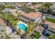 Expansive backyard features a pool and jacuzzi, playground, a putting green, and mature landscaping at 7808 Foothill Ash Ave, Las Vegas, NV 89117