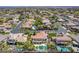 A beautiful aerial shot of a backyard with a pool and immaculately manicured lawn and landscaping at 7808 Foothill Ash Ave, Las Vegas, NV 89117