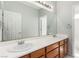 Double sink bathroom with a large mirror at 7808 Foothill Ash Ave, Las Vegas, NV 89117