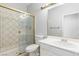 Updated bathroom with a glass-enclosed shower, white vanity, and modern fixtures at 7808 Foothill Ash Ave, Las Vegas, NV 89117