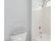 Bright bathroom features a shower over tub and convenient toilet storage at 7808 Foothill Ash Ave, Las Vegas, NV 89117