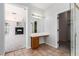 Spacious bathroom with tile flooring, glass shower, and oak vanity with a dressing table at 7808 Foothill Ash Ave, Las Vegas, NV 89117