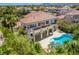 Beautiful home featuring a private pool, spiral staircase, and an upper-level patio with lovely architectural details at 7808 Foothill Ash Ave, Las Vegas, NV 89117