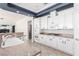 Stylish kitchen with white cabinetry, granite counters, and stainless steel appliances at 7808 Foothill Ash Ave, Las Vegas, NV 89117