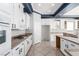 Well-lit kitchen showcasing white cabinets, granite countertops, and modern appliances at 7808 Foothill Ash Ave, Las Vegas, NV 89117