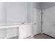 Functional laundry room with sink, countertop, and ample storage space at 7808 Foothill Ash Ave, Las Vegas, NV 89117