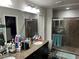 Bathroom featuring double sinks with granite counters and a walk in shower at 8113 Mineola Palms St, Las Vegas, NV 89139