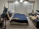 Bedroom with ceiling fan, carpeted floor, and natural light from two windows at 8113 Mineola Palms St, Las Vegas, NV 89139