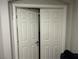 Image of Closet with white bi-fold doors, and a glimpse of the closet interior at 8113 Mineola Palms St, Las Vegas, NV 89139