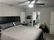 Comfortable main bedroom with a ceiling fan and an ensuite bathroom entrance at 8113 Mineola Palms St, Las Vegas, NV 89139