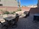 Cozy backyard patio features a brick paver hardscape, sectional sofa, and outdoor furniture at 8113 Mineola Palms St, Las Vegas, NV 89139