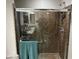 A walk in shower with attractive brown stone-look shower surround at 8113 Mineola Palms St, Las Vegas, NV 89139