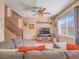 Cozy living room with comfortable seating, natural light, and a decorative ceiling fan at 9301 Euphoria Rose Ave, Las Vegas, NV 89166