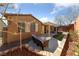 Inviting backyard featuring a cozy patio with comfortable seating and a charming pergola at 9436 Teton Ridge Ave, Las Vegas, NV 89149