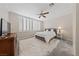 Comfortable bedroom featuring plush carpet, plantation shutters, and a neutral color palette at 9436 Teton Ridge Ave, Las Vegas, NV 89149