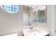 This bathroom features a sink, a vanity with dark cabinets, and a step-in shower at 9643 Ponderosa Skye Ct, Las Vegas, NV 89166