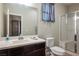 Clean bathroom featuring a vanity, toilet, and walk-in shower at 9643 Ponderosa Skye Ct, Las Vegas, NV 89166