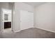 Carpeted bedroom with closet and a bathroom view at 9643 Ponderosa Skye Ct, Las Vegas, NV 89166
