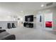 Spacious bonus room on the second floor with carpet flooring and a mounted television at 9643 Ponderosa Skye Ct, Las Vegas, NV 89166