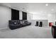 Upstairs bonus room featuring an oversized gray sofa and carpeted floor at 9643 Ponderosa Skye Ct, Las Vegas, NV 89166