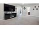 Spacious bonus room featuring a mounted television, carpet floors, and neutral paint at 9643 Ponderosa Skye Ct, Las Vegas, NV 89166