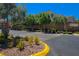 Community entrance with landscaping and signage at 9643 Ponderosa Skye Ct, Las Vegas, NV 89166