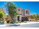 Two-story home featuring desert landscaping and a paver driveway leading to a two-car garage at 9643 Ponderosa Skye Ct, Las Vegas, NV 89166