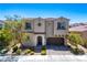 Charming two-story home featuring a well-manicured front yard and a two-car garage at 9643 Ponderosa Skye Ct, Las Vegas, NV 89166