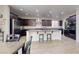 Gourmet kitchen featuring a large kitchen island and stainless steel appliances at 9643 Ponderosa Skye Ct, Las Vegas, NV 89166