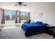 The main bedroom has a large window, blue bedding, and an accent wall with decorative text at 9643 Ponderosa Skye Ct, Las Vegas, NV 89166