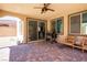 Paver-covered patio with ceiling fan, sliding door and outdoor seating at 9643 Ponderosa Skye Ct, Las Vegas, NV 89166