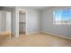 Bedroom featuring light wood floors and natural light from a window at 9932 Twilight Walk Ave, Las Vegas, NV 89149