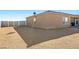 Large backyard with a brick patio, providing ample space for outdoor activities and potential landscaping at 1000 E Enchanted Mesa St, Pahrump, NV 89048