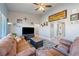 Cozy living room with sofa, ceiling fan and decorative wall art at 1000 E Enchanted Mesa St, Pahrump, NV 89048