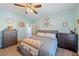 Well-lit bedroom with neutral walls, coordinating furniture, and a ceiling fan at 1000 E Enchanted Mesa St, Pahrump, NV 89048