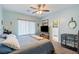 Tranquil bedroom featuring a ceiling fan, soft carpet, and neutral color palette at 1000 E Enchanted Mesa St, Pahrump, NV 89048