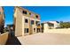 A yellow home featuring a balcony and low-maintenance dirt backyard at 10716 Shasta Glow Ct, Henderson, NV 89052