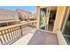 Balcony featuring wrought iron railing, sliding glass door, and views of the surrounding neighborhood at 10716 Shasta Glow Ct, Henderson, NV 89052