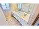 Bathroom featuring a double sink vanity with white cabinets and tile floors at 10716 Shasta Glow Ct, Henderson, NV 89052