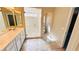 Bathroom with a double vanity sink and a glass door walk-in shower at 10716 Shasta Glow Ct, Henderson, NV 89052