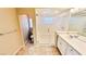 Bathroom with a glass enclosed shower and double sinks at 10716 Shasta Glow Ct, Henderson, NV 89052