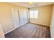 Bedroom with a window and closet with double doors at 10716 Shasta Glow Ct, Henderson, NV 89052